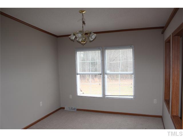 117 Vernon Hill Church Road Roxboro, NC 27574 - Photo 8 of 12 a view of an empty room with a window