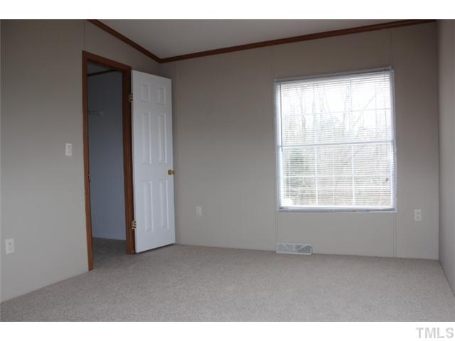 117 Vernon Hill Church Road Roxboro, NC 27574 - Photo 9 of 12 a view of an empty room with a window