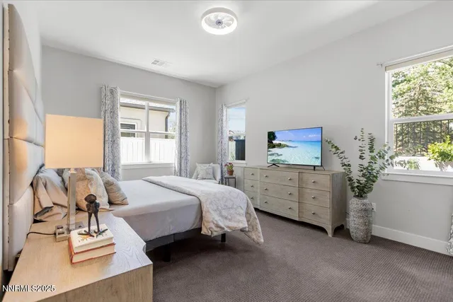 a bathroom with a sink and mirror with toilet