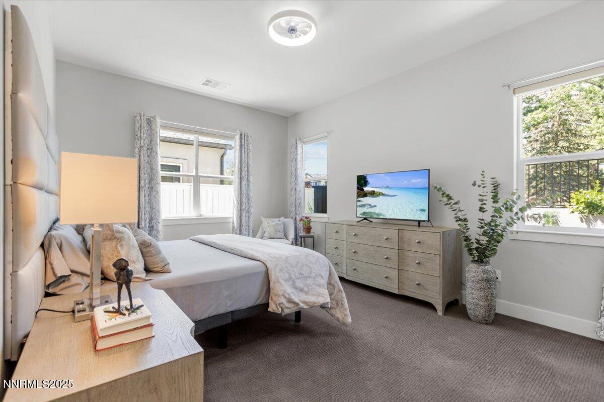 5517 Western Rider Trail Reno, NV 89511 - Photo 19 of 49 a bed room with a bed window and a dresser