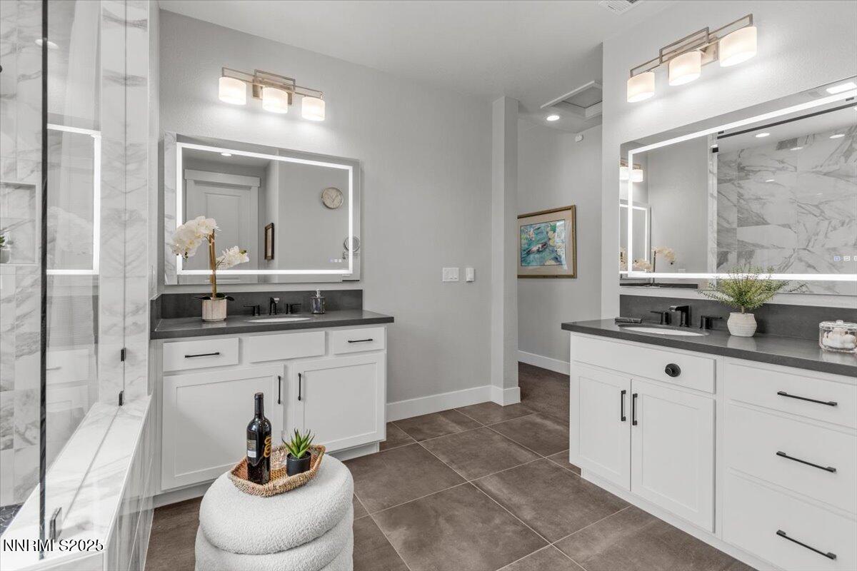 5517 Western Rider Trail Reno, NV 89511 - Photo 20 of 49 a bathroom with a sink and mirror with toilet
