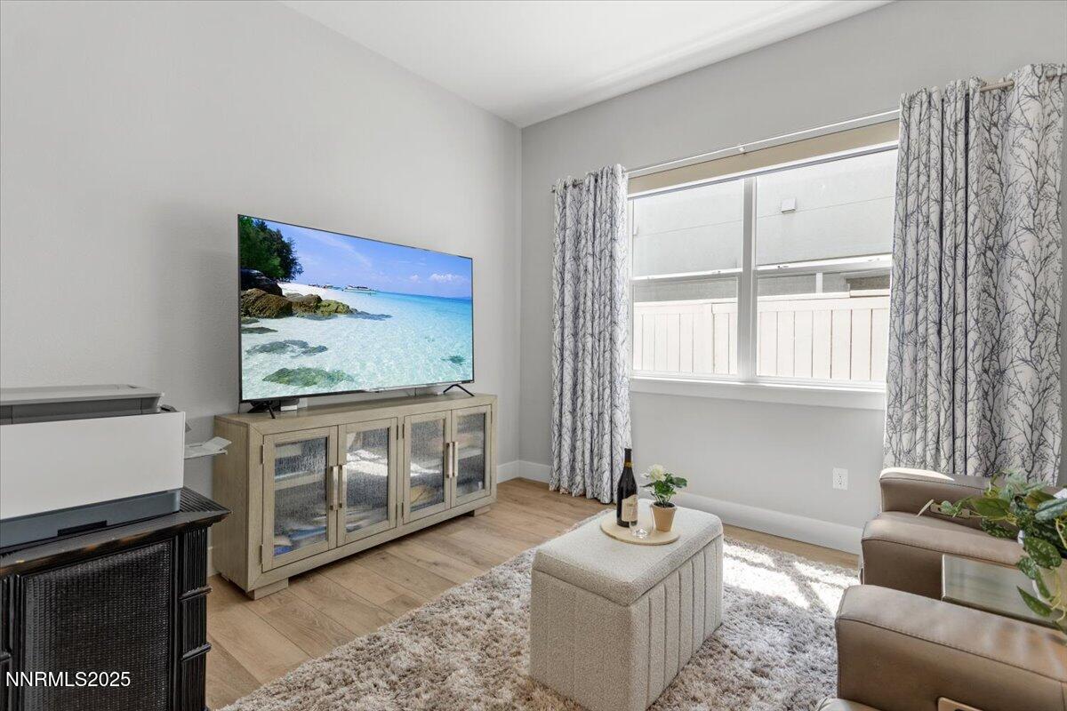 5517 Western Rider Trail Reno, NV 89511 - Photo 24 of 49 a living room with furniture and a flat screen tv