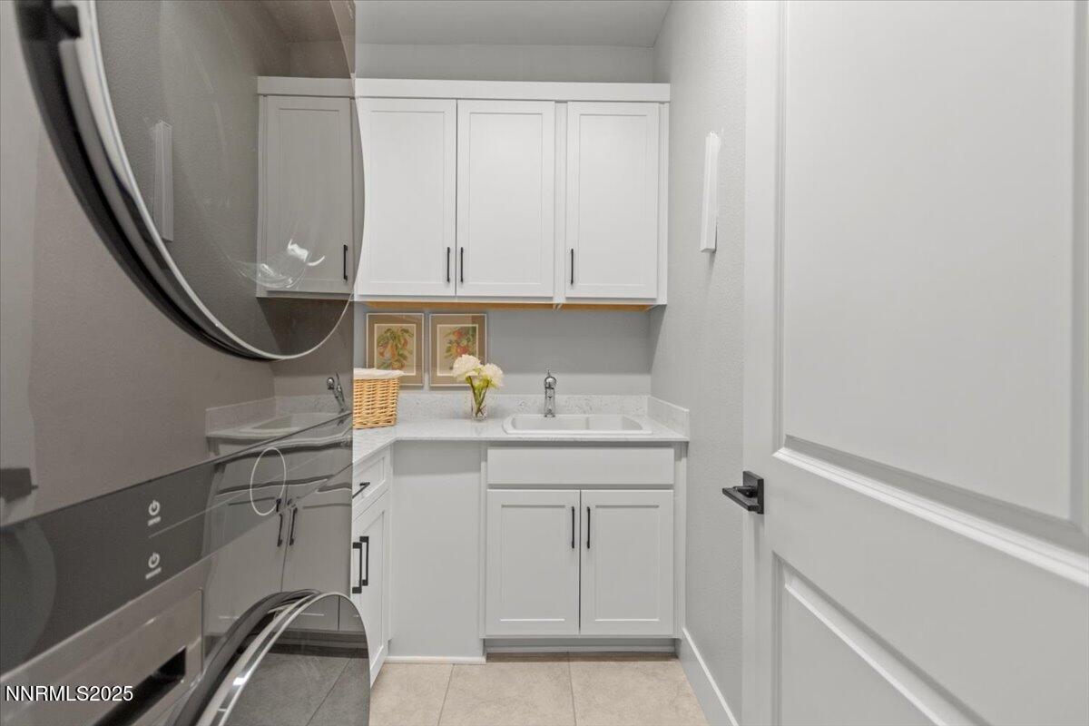 5517 Western Rider Trail Reno, NV 89511 - Photo 26 of 49 a kitchen with a sink and cabinets