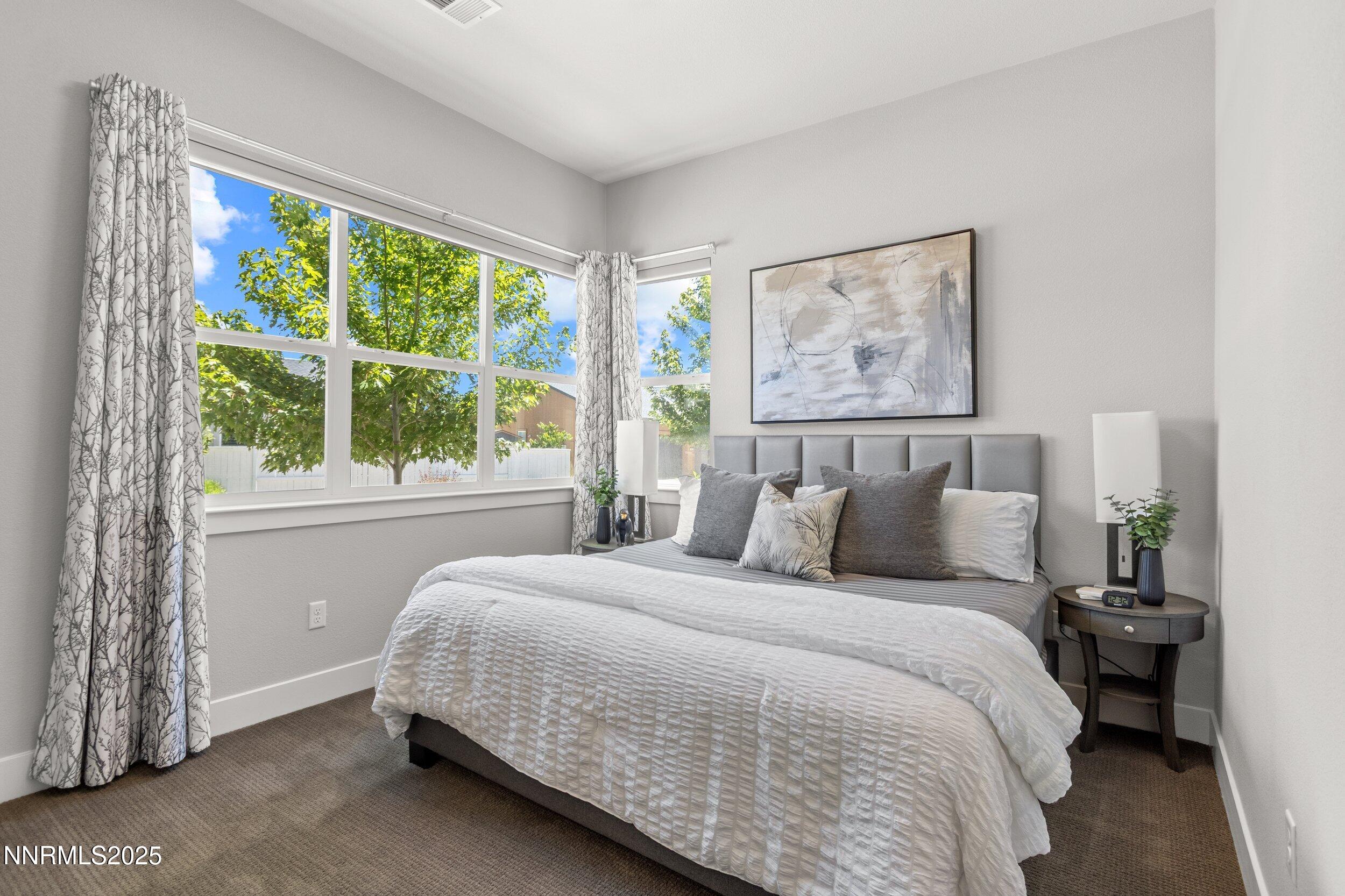 5517 Western Rider Trail Reno, NV 89511 - Photo 27 of 49 a bedroom with a bed and a painting on the wall