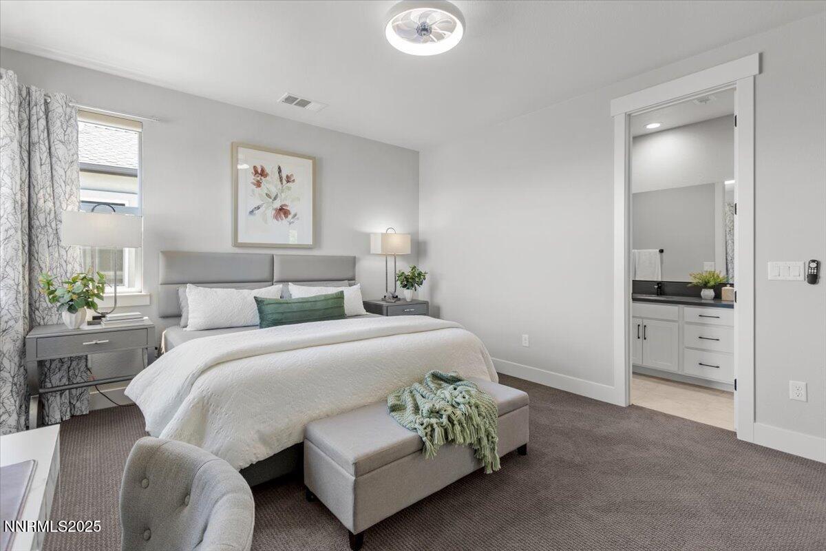 5517 Western Rider Trail Reno, NV 89511 - Photo 34 of 49 a spacious bedroom with a bed and a cabinets