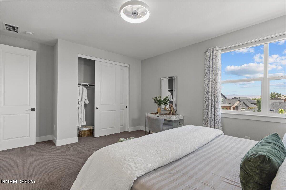 5517 Western Rider Trail Reno, NV 89511 - Photo 35 of 49 a bedroom with a bed and a large window
