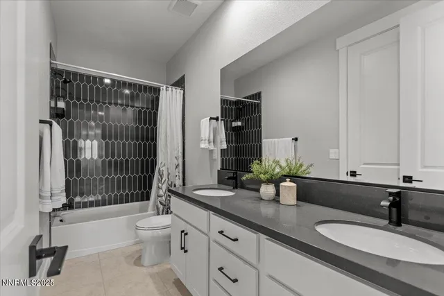 a view of a patio with couches table and chairs under an umbrella with a barbeque