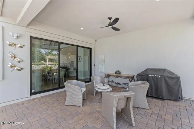 a lobby with furniture and large windows