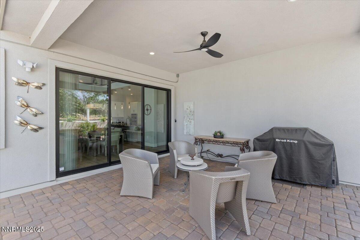 5517 Western Rider Trail Reno, NV 89511 - Photo 38 of 49 a view of a dining room with furniture window and outside view