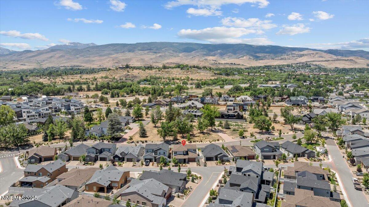 5517 Western Rider Trail Reno, NV 89511 - Photo 42 of 49 an aerial view of a city with lots of residential buildings and mountain view in back