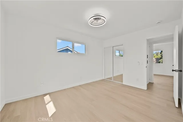 a bathroom with a sink a mirror and shower