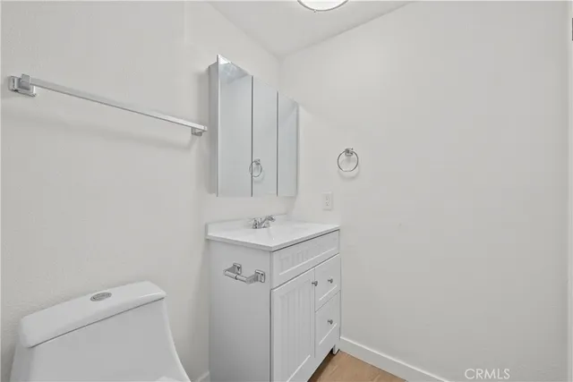 an empty room with fireplace and a window