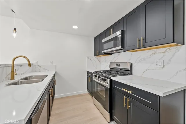 a kitchen with a sink and a window