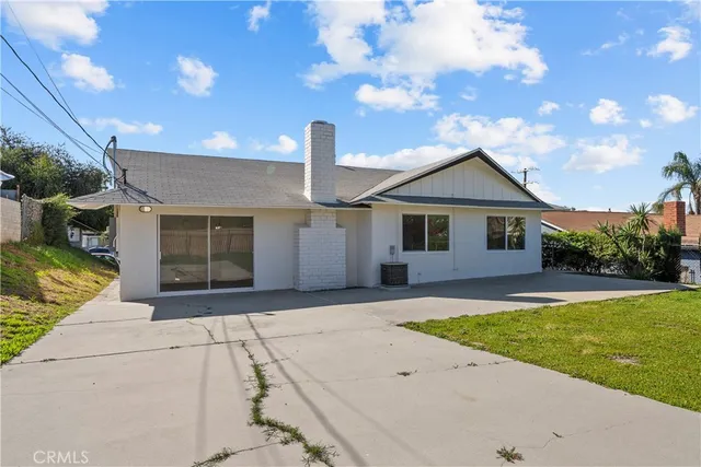 a view of a garden with a building in the background