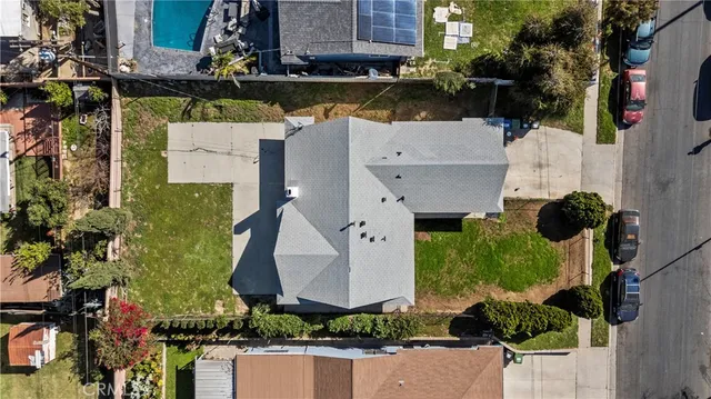 an aerial view of multiple houses with yard