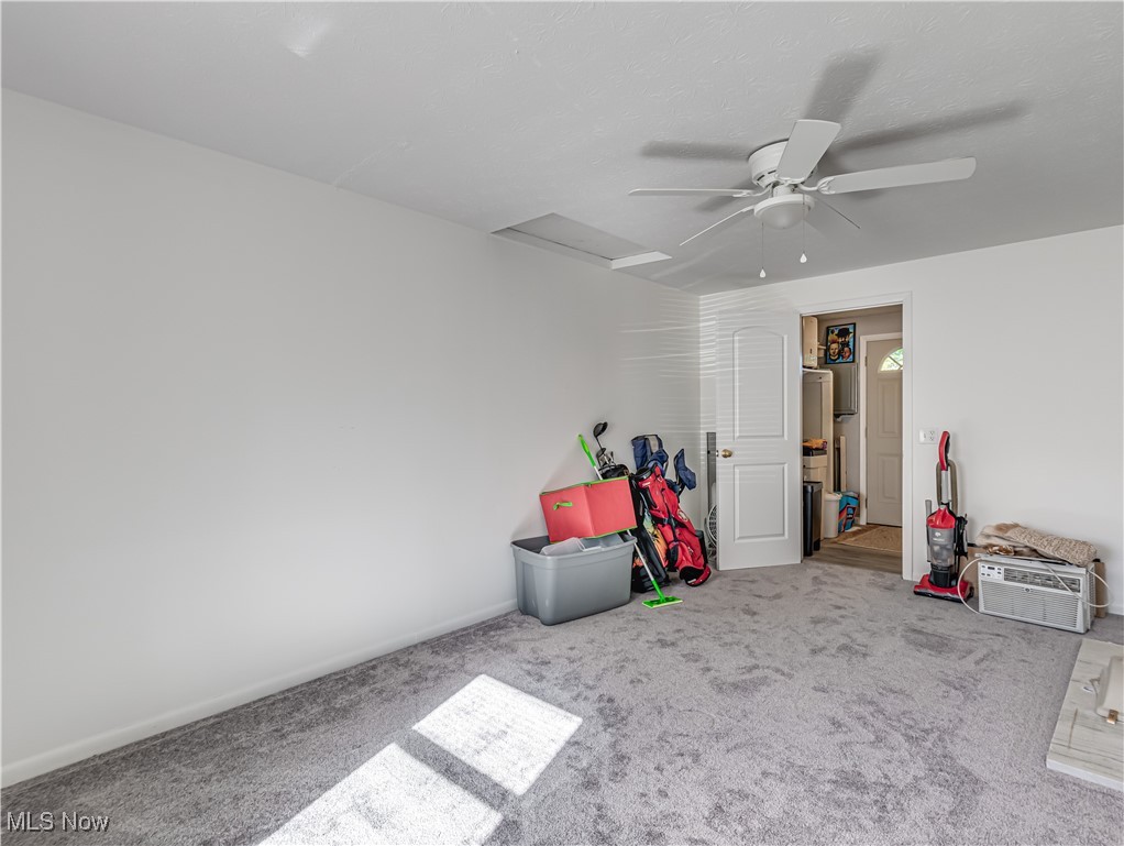1119 Chaparrel Road Southwest Hartville, OH 44632 - Photo 10 of 23 Bedroom featuring light carpet and ceiling fan