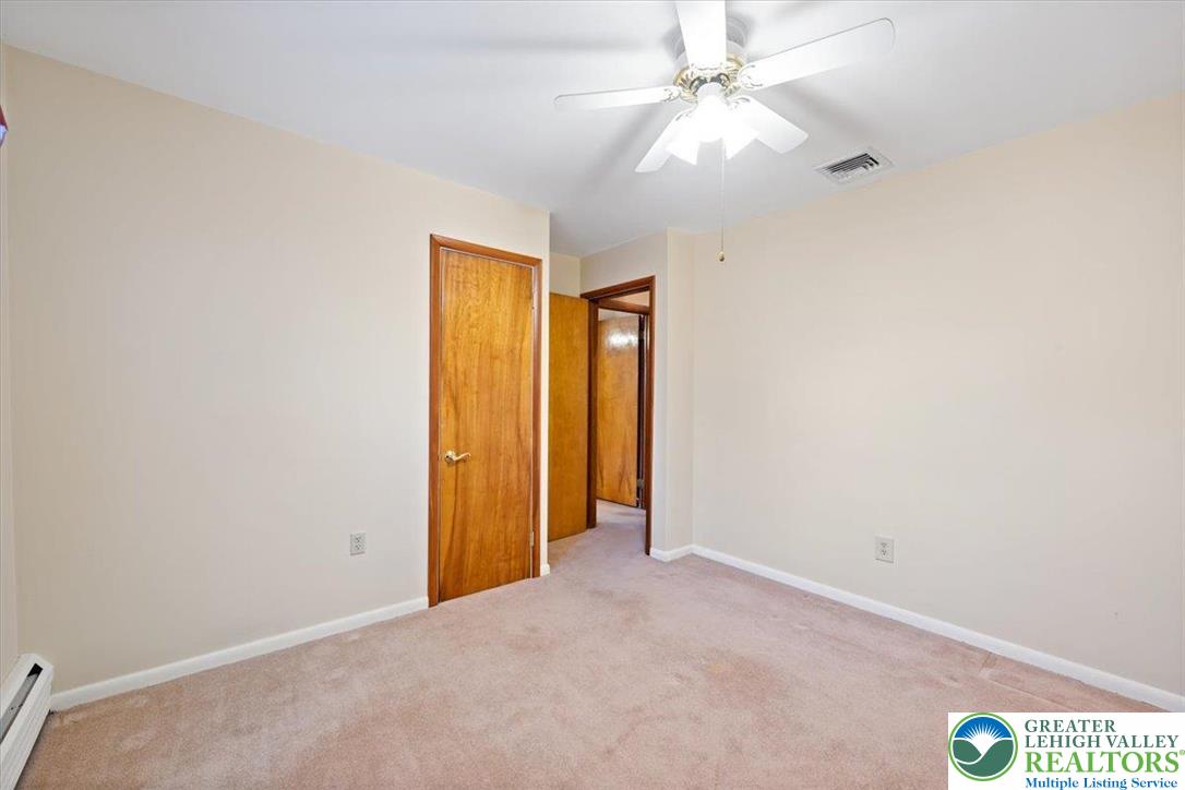 1240 Ridge Avenue Whitehall, PA 18052 - Photo 24 of 52 an empty room with closet and a ceiling fan