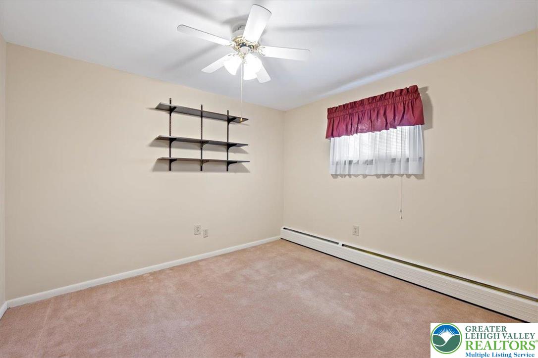 1240 Ridge Avenue Whitehall, PA 18052 - Photo 25 of 52 an empty room with windows and fan