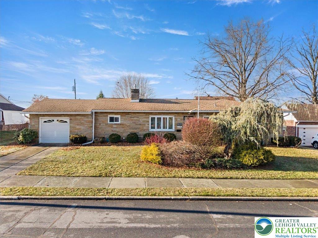 1240 Ridge Avenue Whitehall, PA 18052 - Photo 3 of 52 a front view of a house with a yard