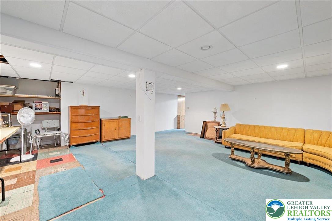 1240 Ridge Avenue Whitehall, PA 18052 - Photo 34 of 52 a spacious bedroom with a bed and a couch