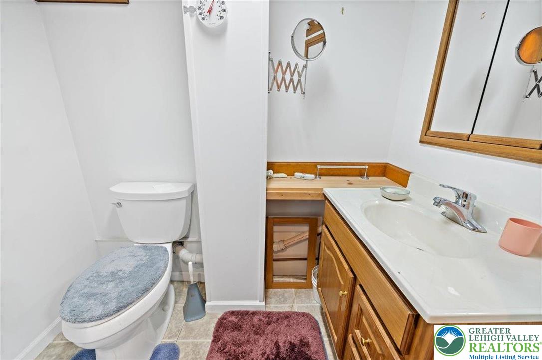 1240 Ridge Avenue Whitehall, PA 18052 - Photo 36 of 52 a bathroom with a sink toilet and shower