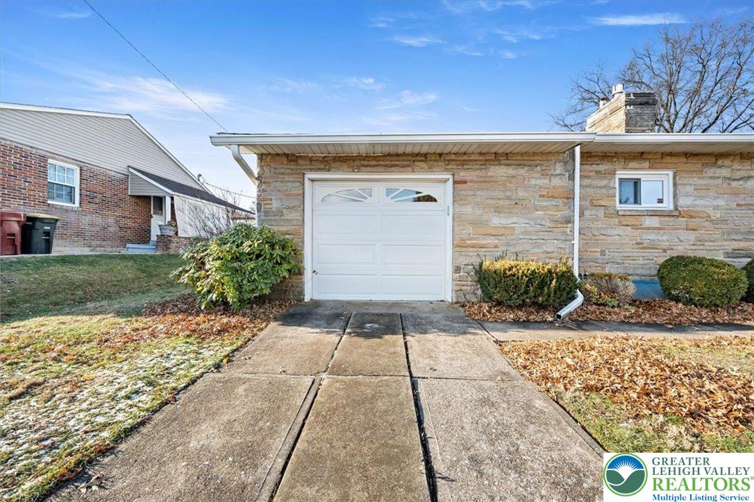 1240 Ridge Avenue Whitehall, PA 18052 - Photo 46 of 52 a front view of a house with garden