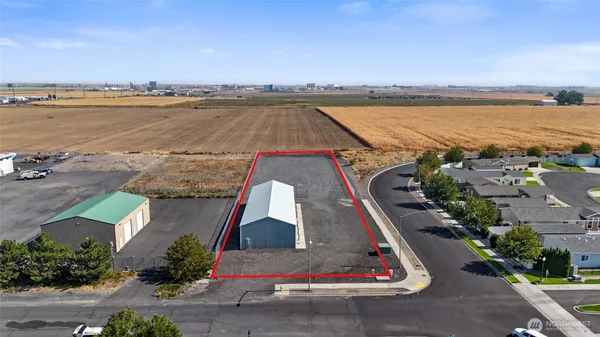an aerial view of a house with a lake view