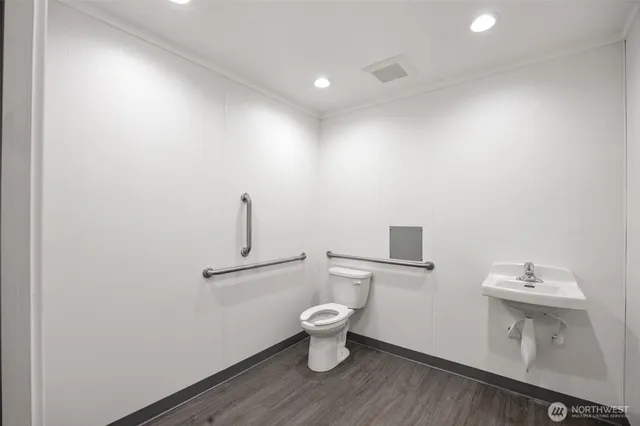 a bathroom with a toilet and a sink