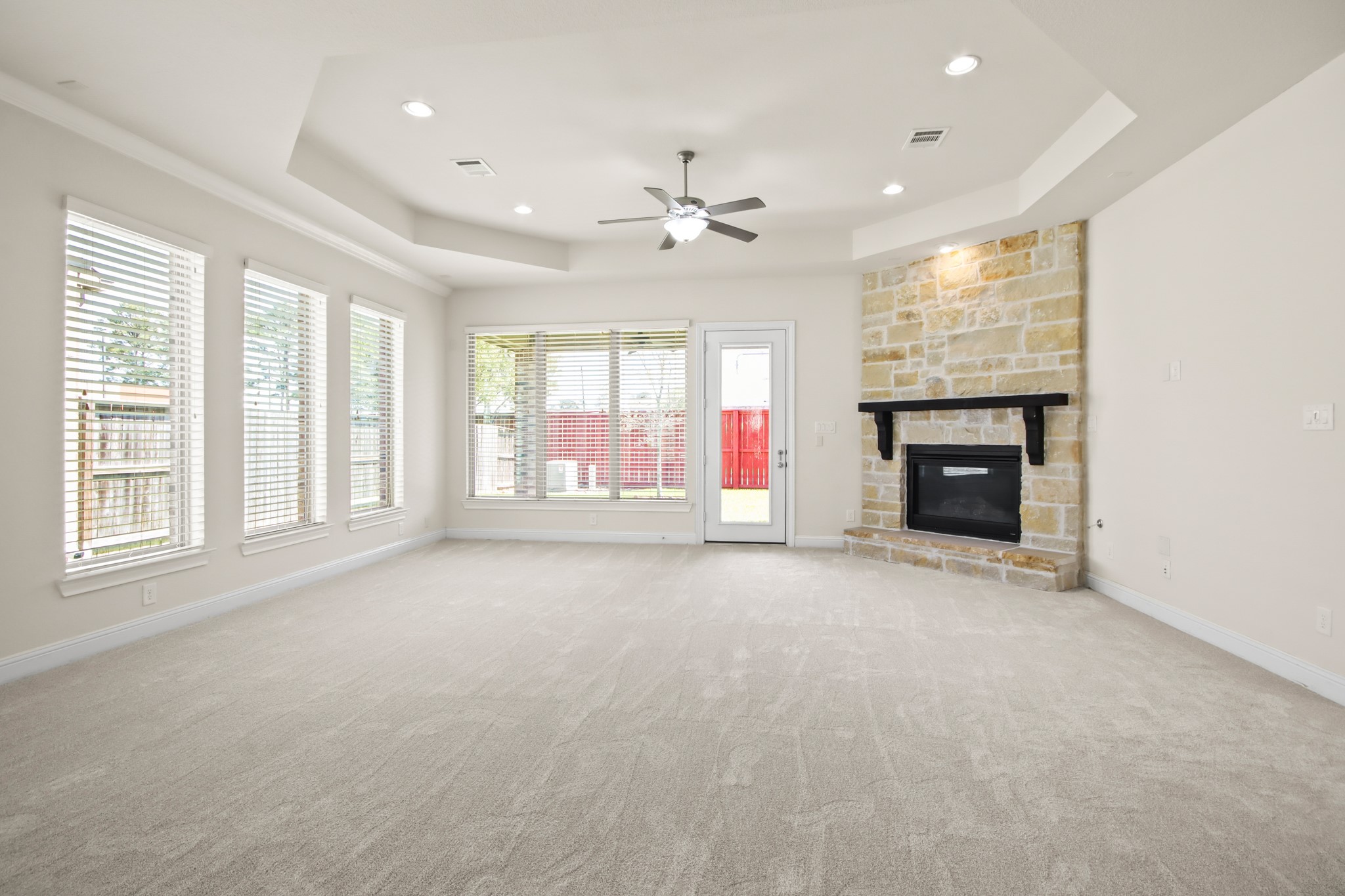 8931 Leaning Hollow Lane Spring, TX 77379 - Photo 2 of 38 Huge Great Room with a stone fireplace, recessed lighting and lots of windows for natural lighting. New Carpet Recently Installed.
