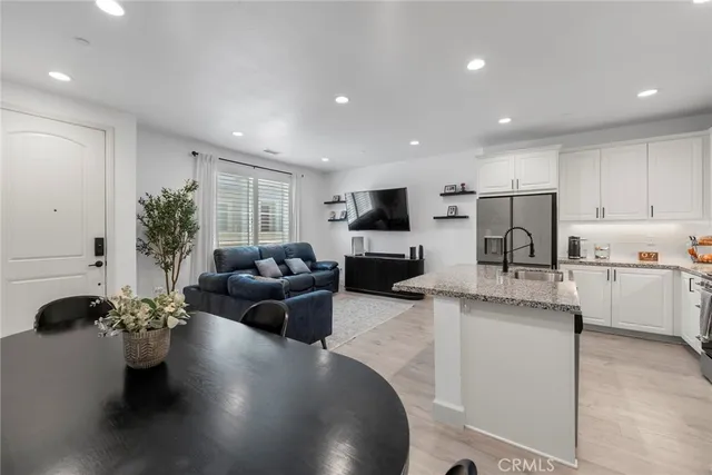 a view of hallway with stairs and wooden floor