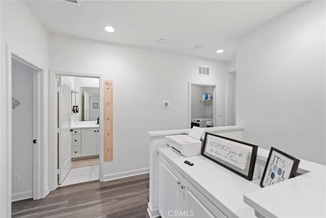 a bathroom with a double vanity sink a mirror and a shower