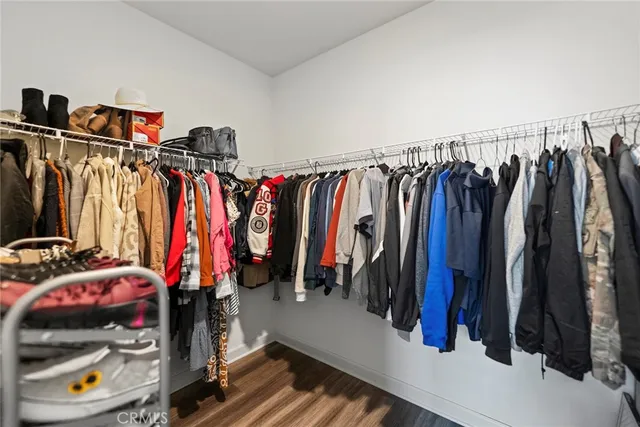 a bedroom with furniture a baby crib and a window