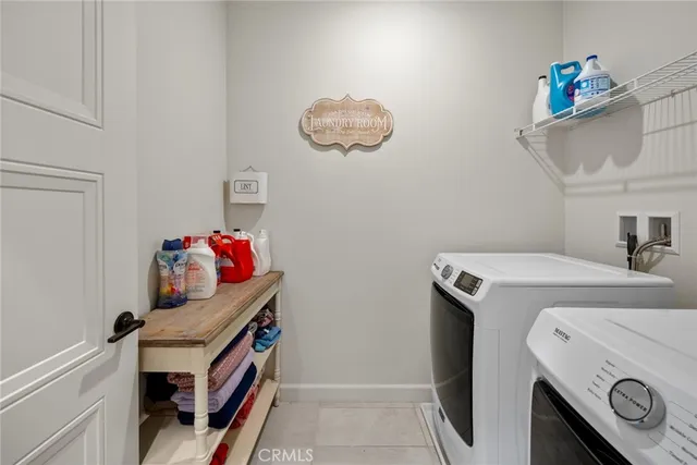 an outdoor sitting area with furniture and garden