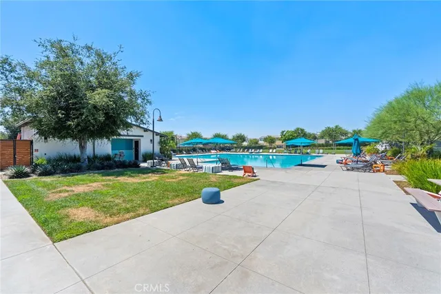 a view of a swimming pool with an outdoor space and seating area