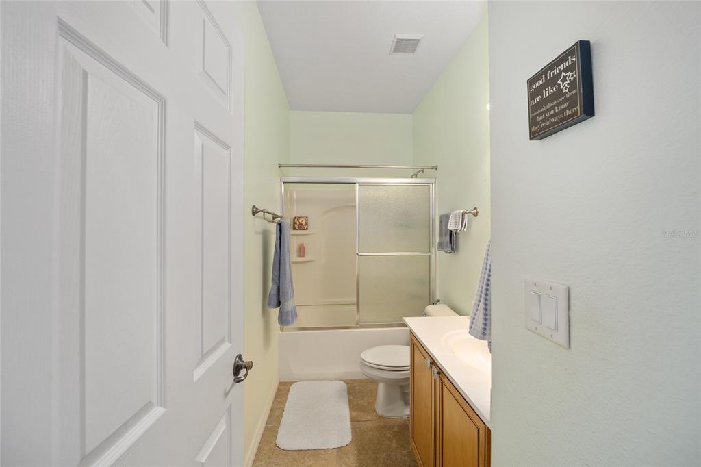 7947 South W 83rd Place Ocala, FL 34476 - Photo 12 of 28 a bathroom with a sink a toilet and shower
