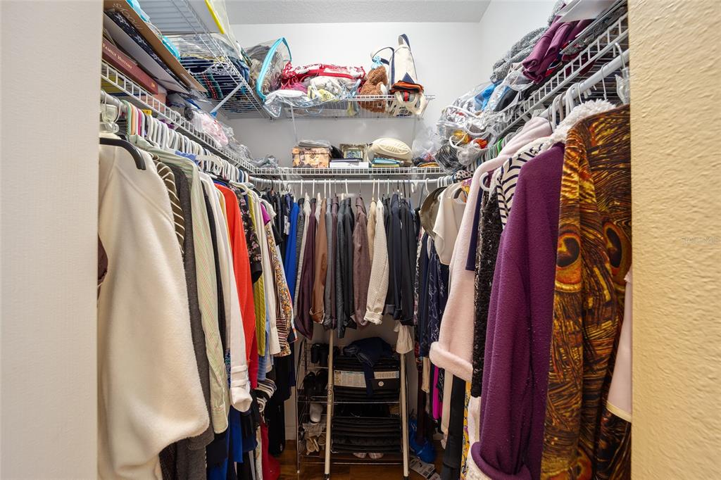 7947 South W 83rd Place Ocala, FL 34476 - Photo 14 of 28 a view of walk in closet with clothes