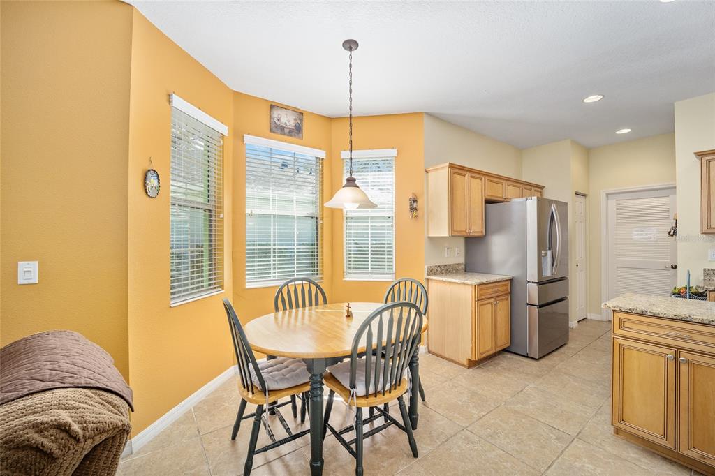 7947 South W 83rd Place Ocala, FL 34476 - Photo 16 of 28 a kitchen with a refrigerator and countertop