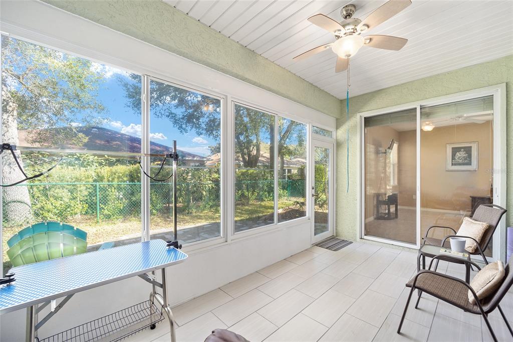7947 South W 83rd Place Ocala, FL 34476 - Photo 19 of 28 a living room with furniture and a floor to ceiling window