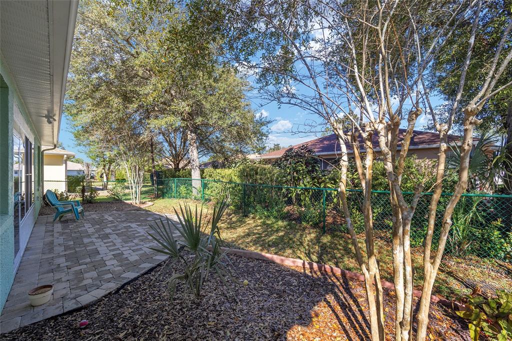 7947 South W 83rd Place Ocala, FL 34476 - Photo 2 of 28 a view of a yard with plants and trees