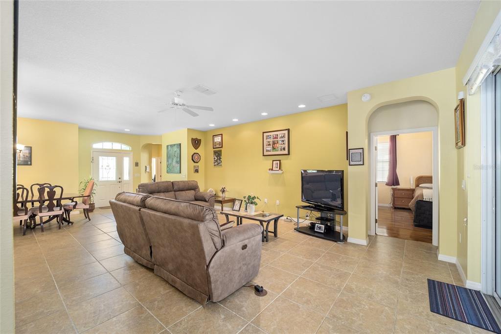 7947 South W 83rd Place Ocala, FL 34476 - Photo 25 of 28 a living room with furniture and a flat screen tv