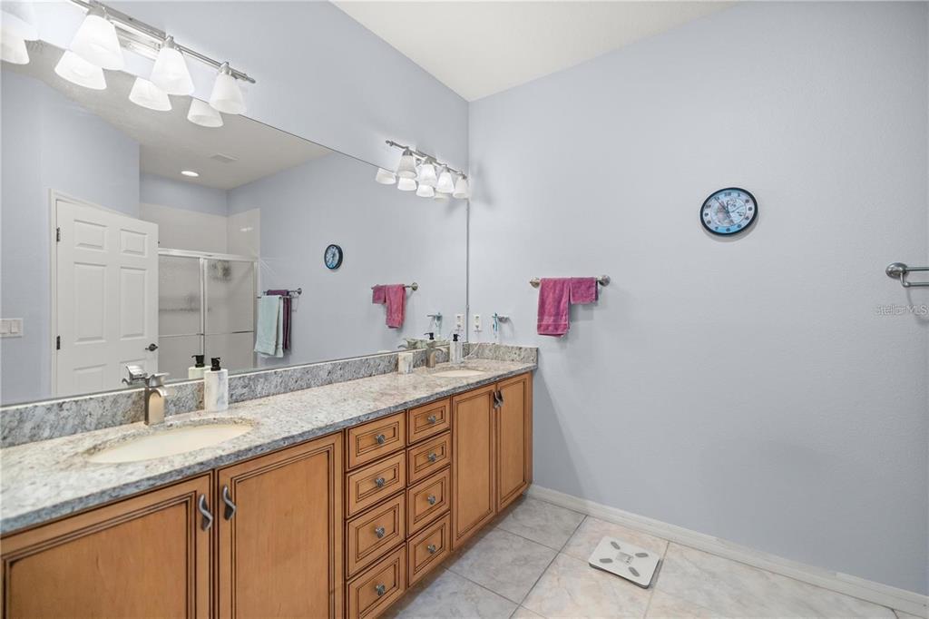 7947 South W 83rd Place Ocala, FL 34476 - Photo 28 of 28 a bathroom with a granite countertop double vanity sink and a mirror