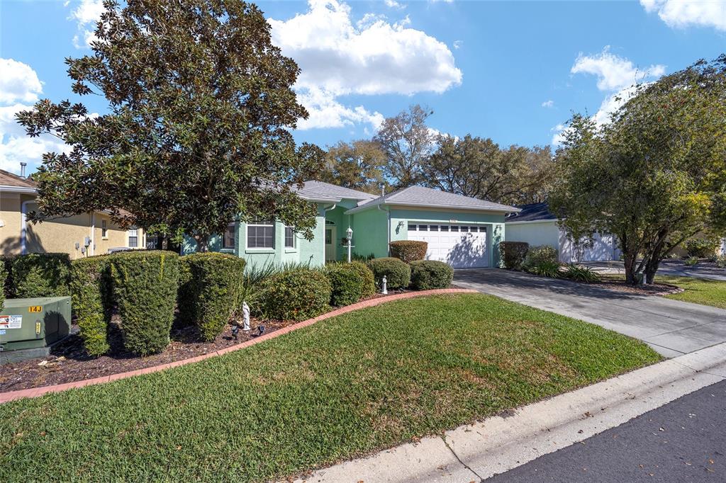 7947 South W 83rd Place Ocala, FL 34476 - Photo 3 of 28 front view of a house with a yard