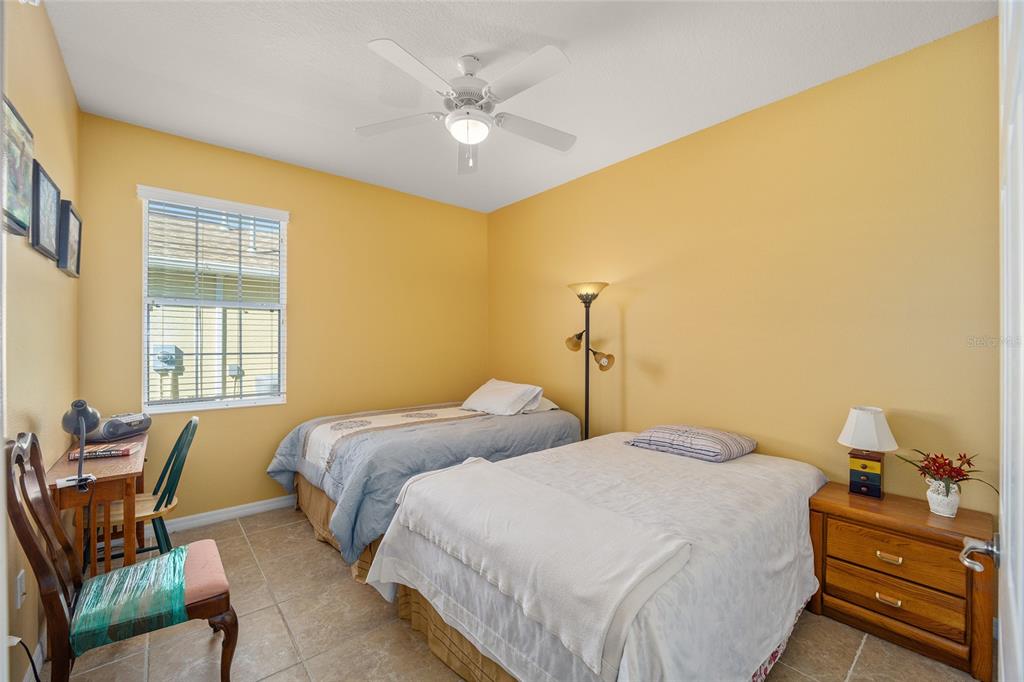 7947 South W 83rd Place Ocala, FL 34476 - Photo 5 of 28 a bedroom with a bed and a couch
