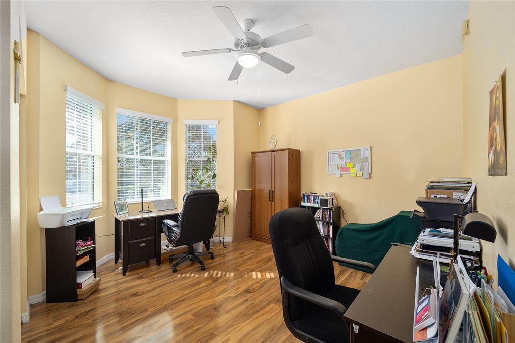 7947 South W 83rd Place Ocala, FL 34476 - Photo 6 of 28 a view of a livingroom with workspace and a window