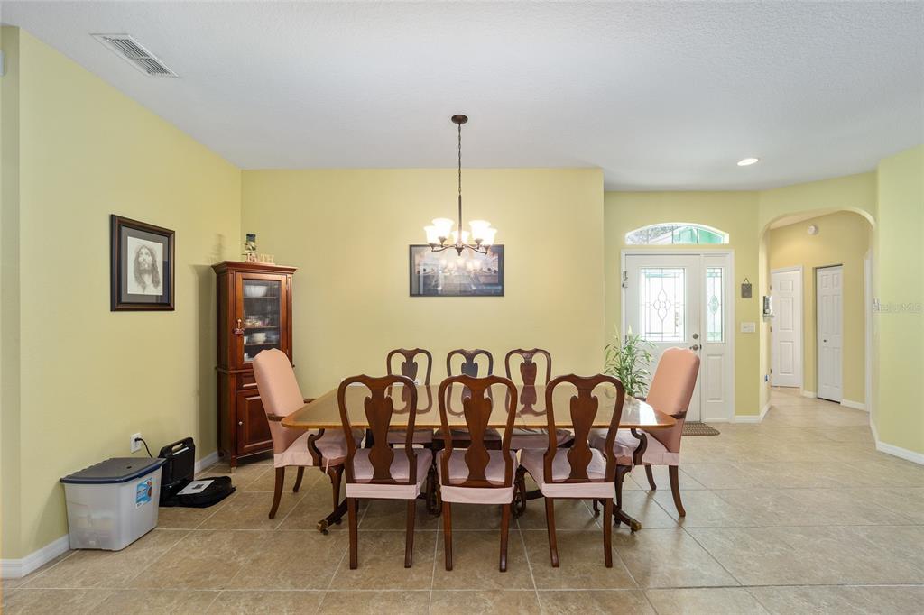 7947 South W 83rd Place Ocala, FL 34476 - Photo 7 of 28 a dining room with furniture and window