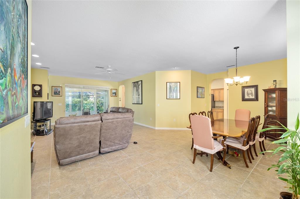 7947 South W 83rd Place Ocala, FL 34476 - Photo 10 of 28 a living room with furniture and a large window