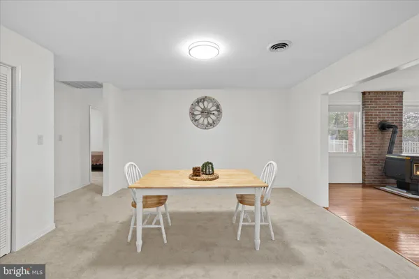 a dining room with furniture and window