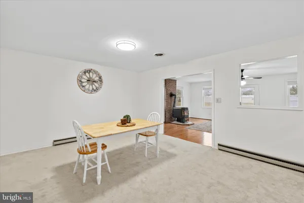 a view of a livingroom with furniture and a kitchen