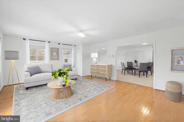 a view of a dining room with furniture and a table