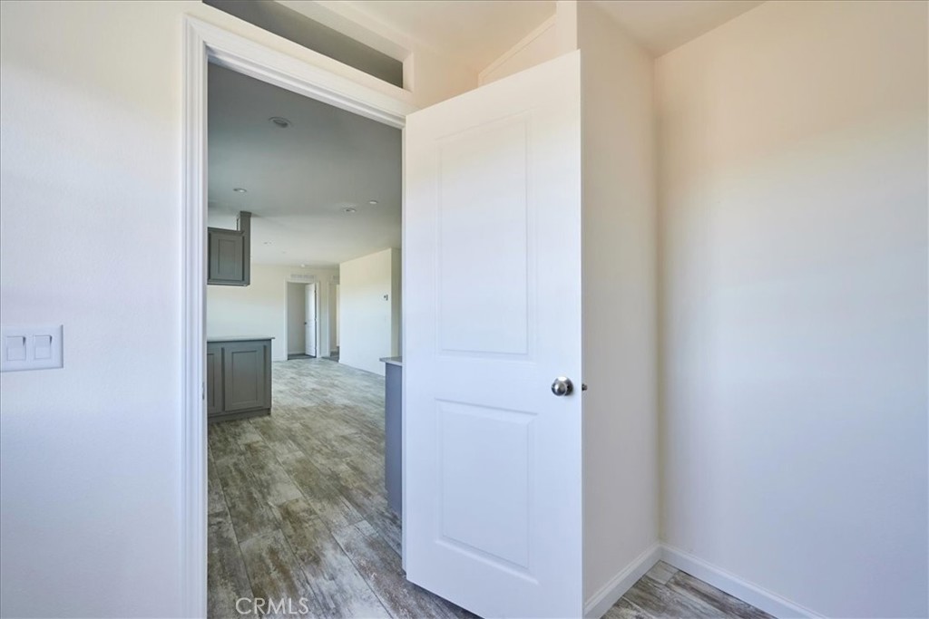 11475 Descanso Road Pinon Hills, CA 92372 - Photo 15 of 35 a view of a room with wooden floor